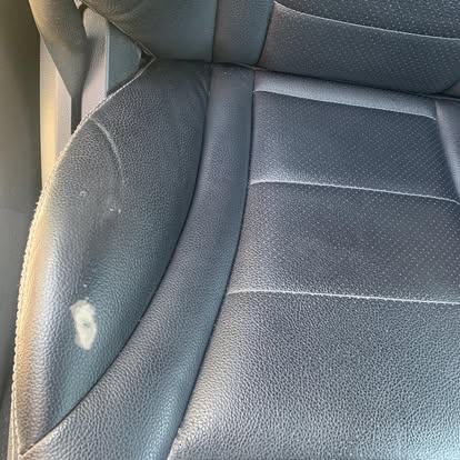 Peeling faux leather car seat before professional repair